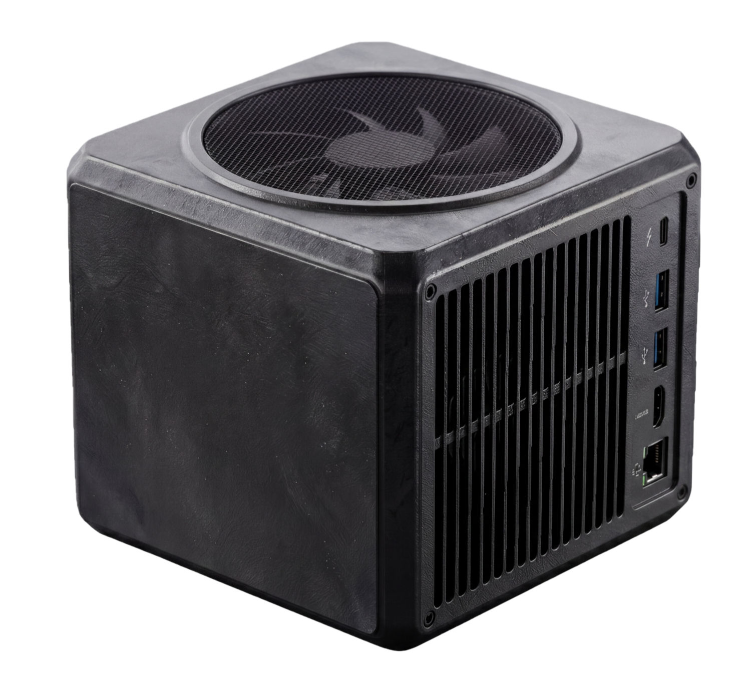 Kino — a matte-black aluminum cube with mesh-grille top fan, side ventilation, USB-C / Thunderbolt + 2× USB-A 3.0 + HDMI 2.1a + Gigabit ports on the rear